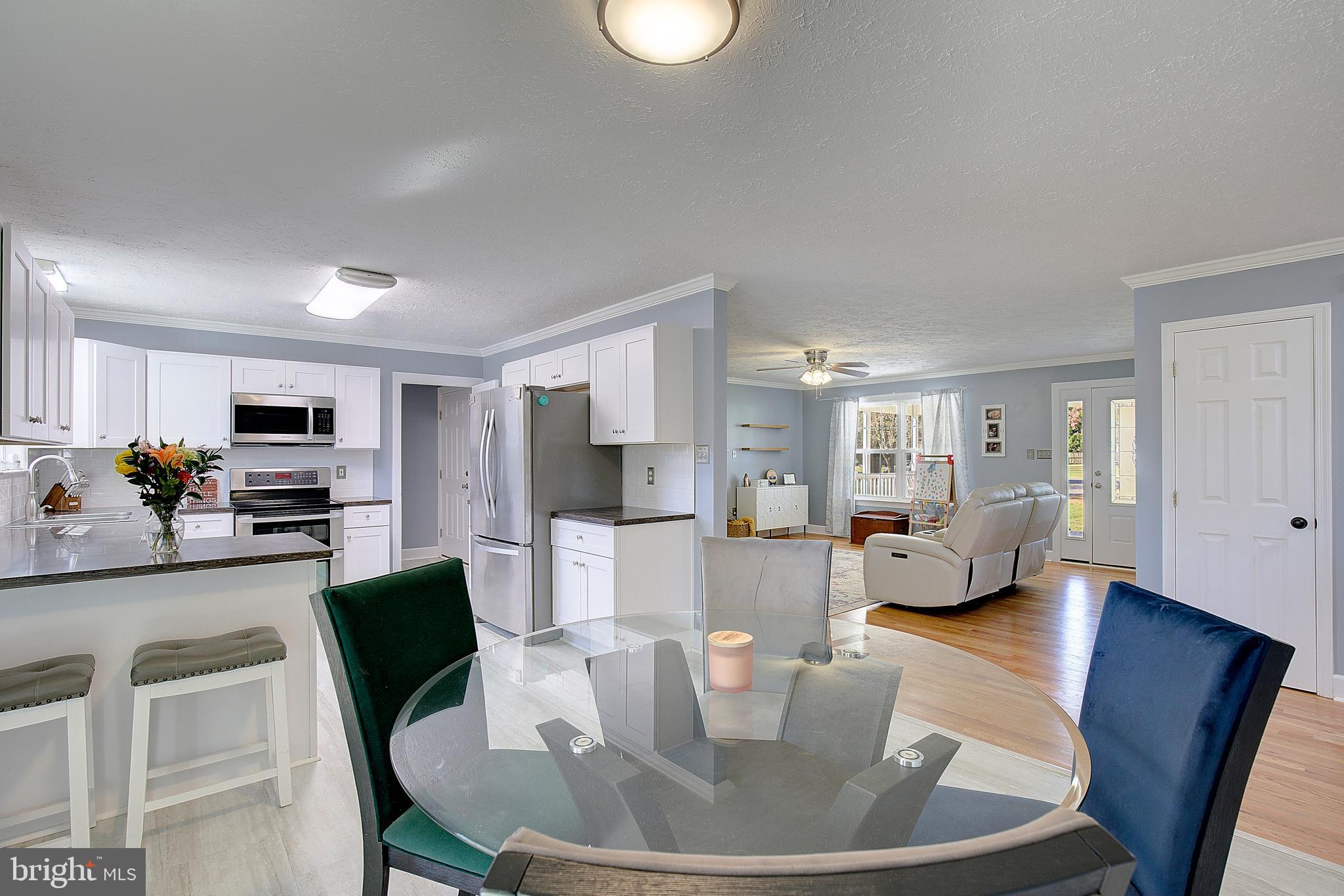 26282 Rio Bravo Lane Mechanicsville, MD 20659 - Photo 11 of 52 a living room with furniture and a flat screen tv
