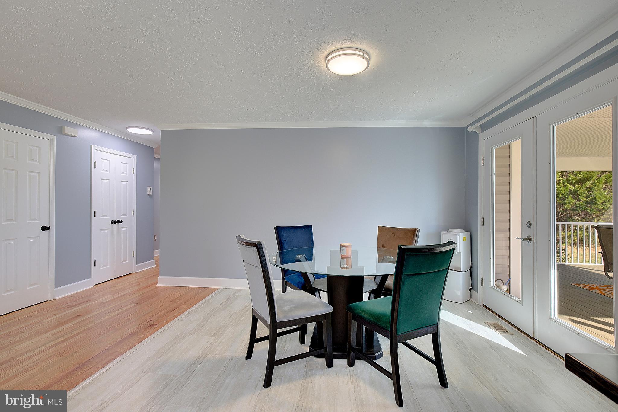 26282 Rio Bravo Lane Mechanicsville, MD 20659 - Photo 12 of 52 a view of a dining room with furniture and wooden floor
