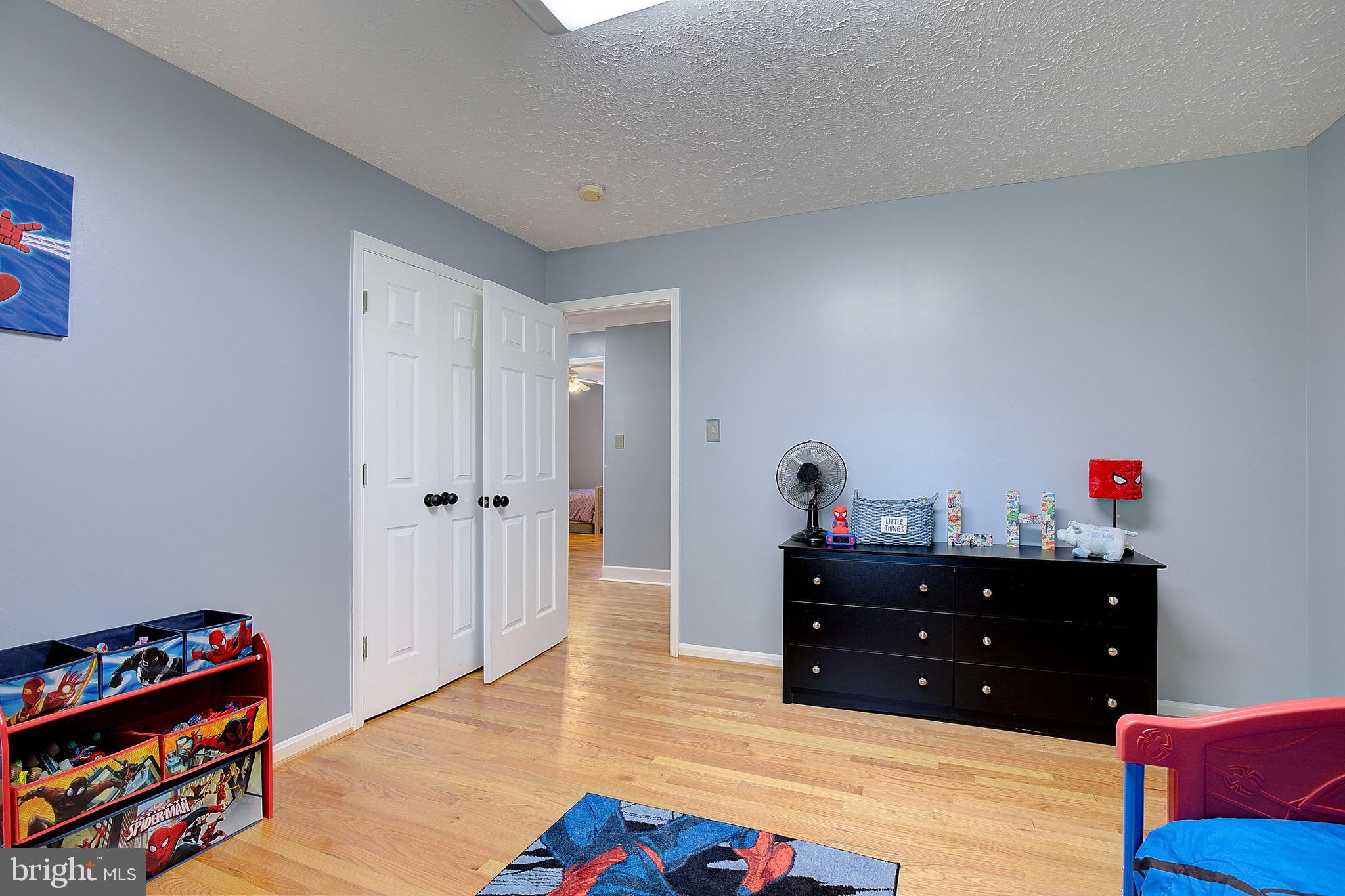 26282 Rio Bravo Lane Mechanicsville, MD 20659 - Photo 22 of 52 a bed room with a bed and a book shelf