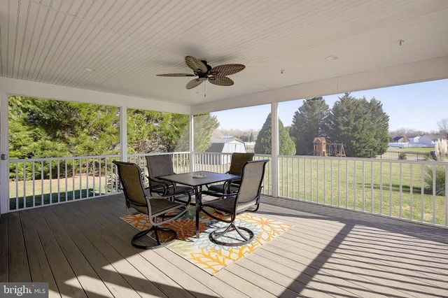 a view of a patio with wooden floor