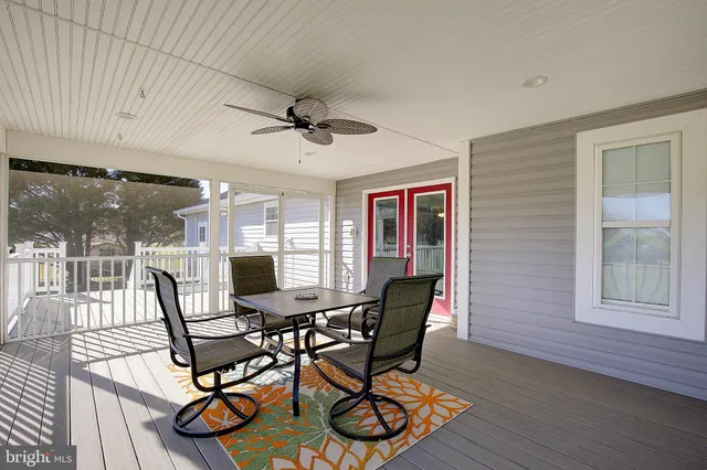 a view of a dining room with furniture wooden floor and a chandelier