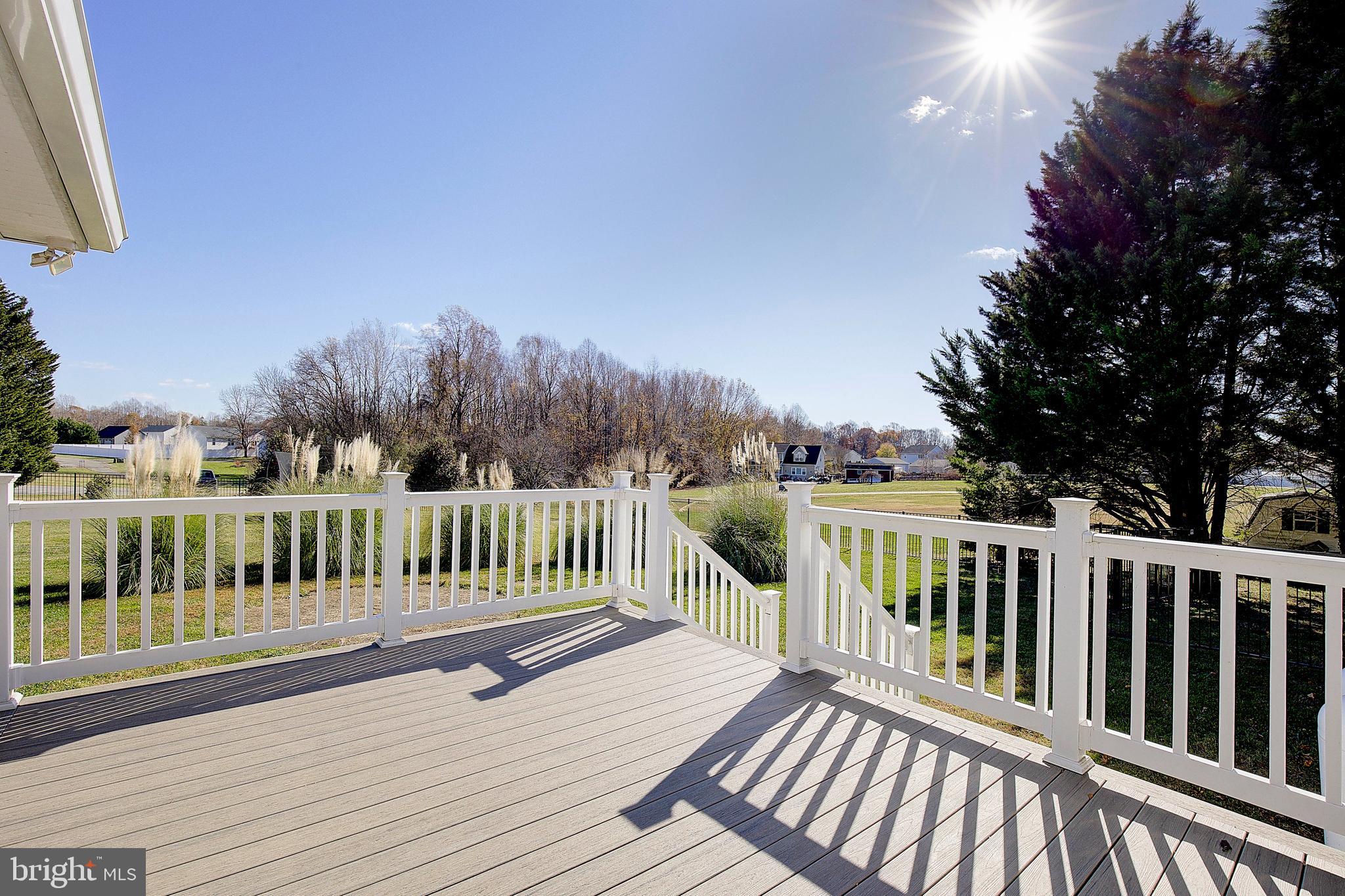26282 Rio Bravo Lane Mechanicsville, MD 20659 - Photo 36 of 52 a view of balcony with wooden floor and fence