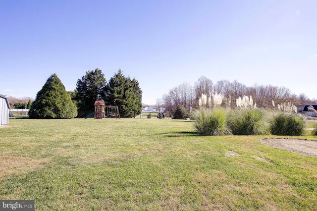 a swimming pool with trees in the background