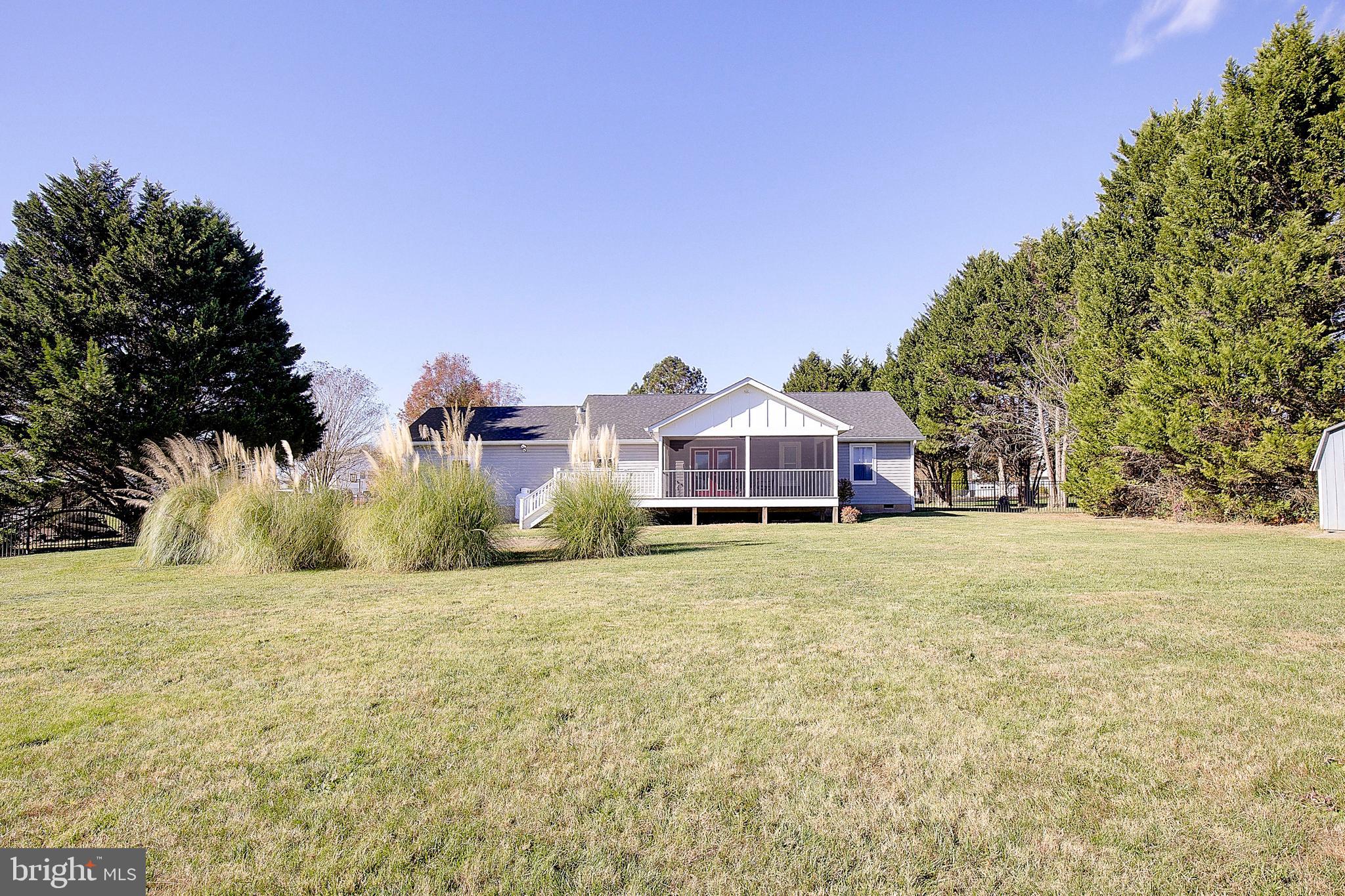 26282 Rio Bravo Lane Mechanicsville, MD 20659 - Photo 41 of 52 a front view of a house with a yard and a large tree