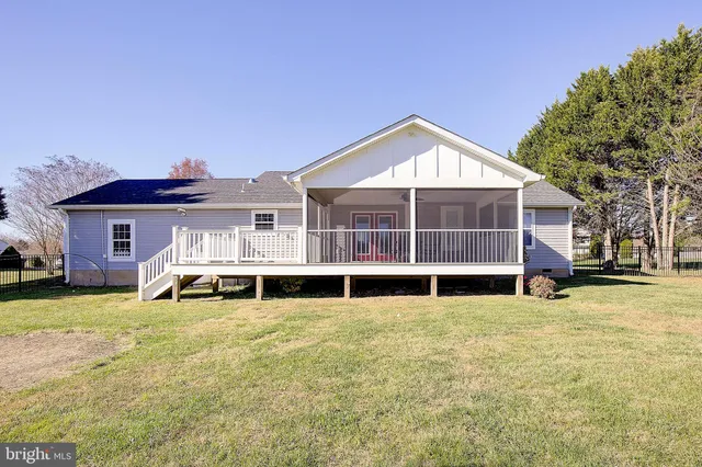 a front view of house with yard outdoor seating and green space