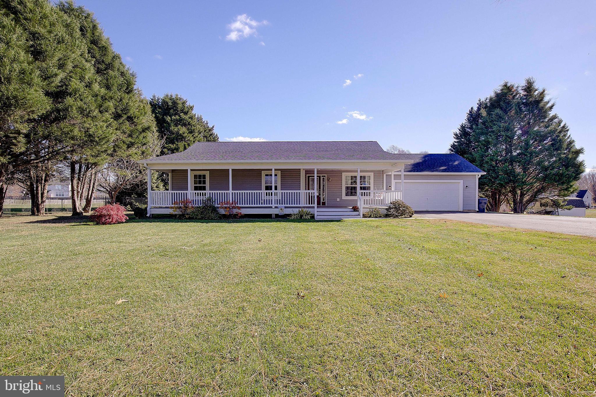 26282 Rio Bravo Lane Mechanicsville, MD 20659 - Photo 46 of 52 a front view of a building with a garden and plants