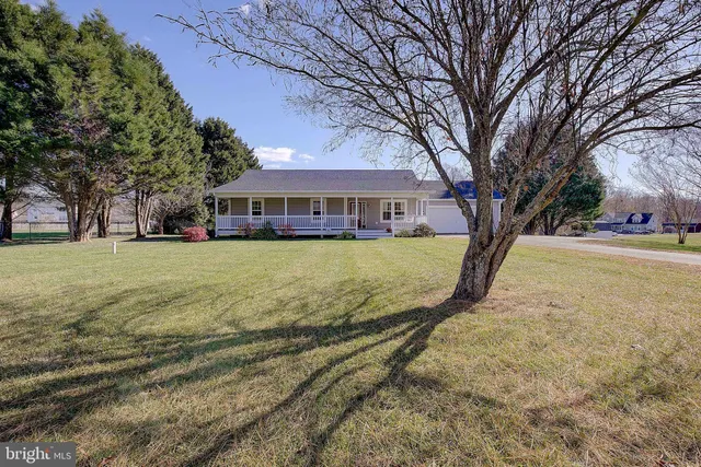 a view of a porch with wooden floor and outdoor space