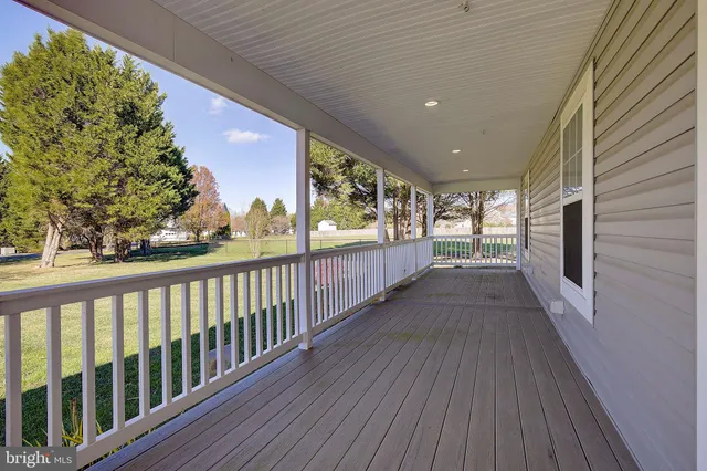a view of outdoor space with deck and wooden floor