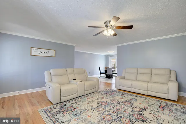 a living room with furniture and a rug