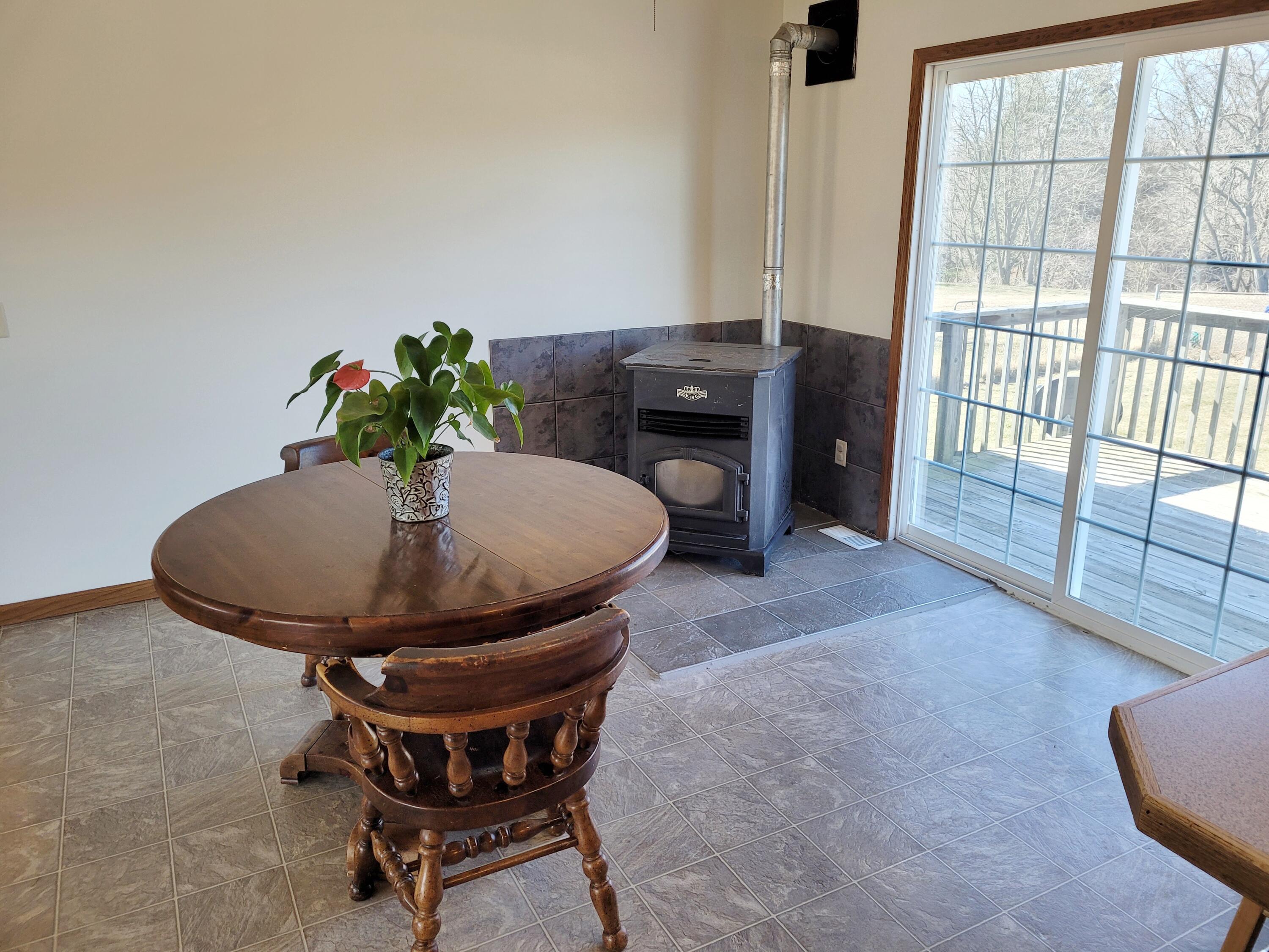 7228 Hancock Road Montague, MI 49437 - Photo 7 of 38 Dining room & outdoors deck