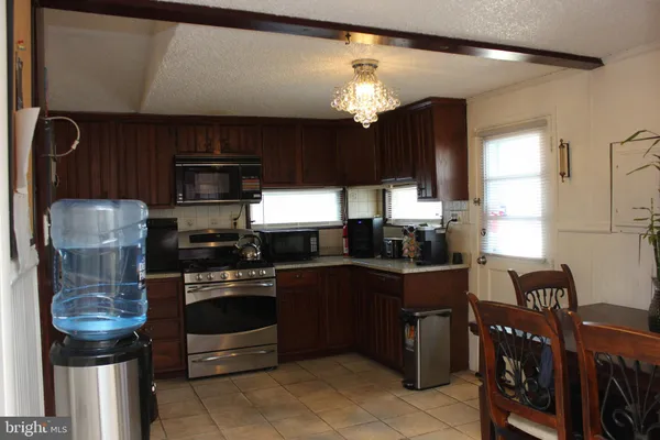a kitchen with cabinets and appliances