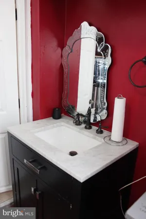 a room with a table chairs and appliances