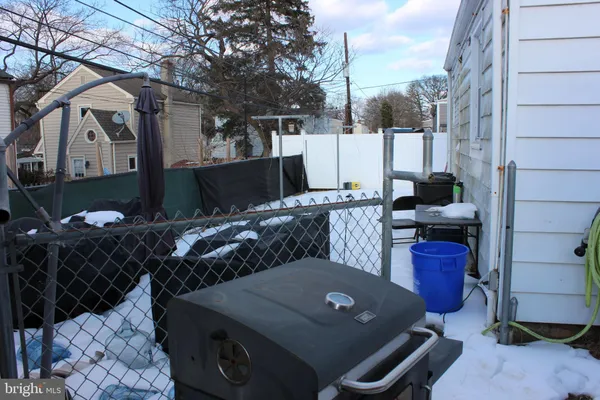 a view of a backyard with sitting area