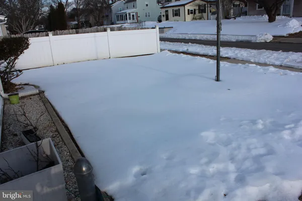 a view of a house with a snow in the yard