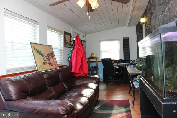 a living room with furniture a rug and a chandelier
