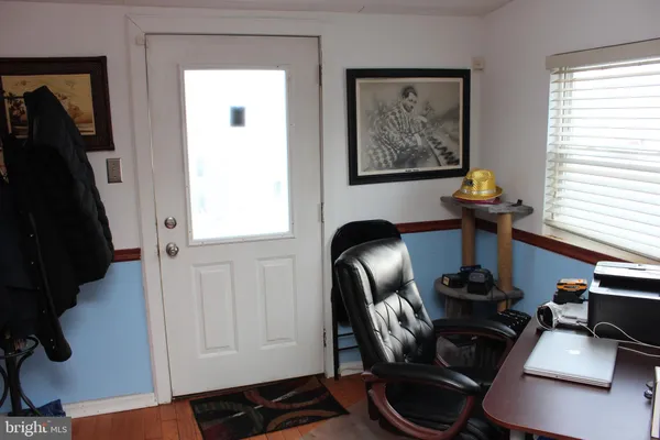 a room with furniture and wooden floor