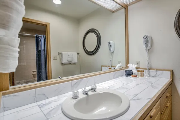 a bathroom with a toilet and a bathtub
