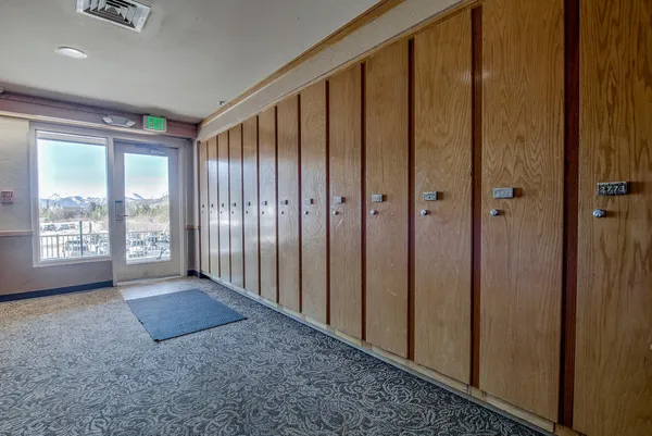 a view of an entryway with wooden floor
