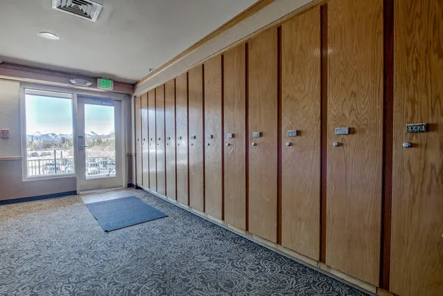a view of an entryway with wooden floor