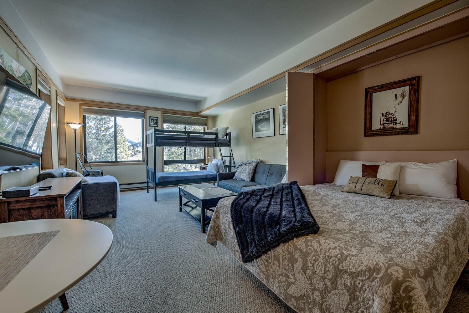 1211 West Keystone Road, Unit 2757 Keystone, CO 80435 - Photo 25 of 46 a bedroom with a bed couch and a large window