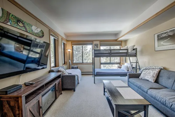 a living room with furniture and a large window