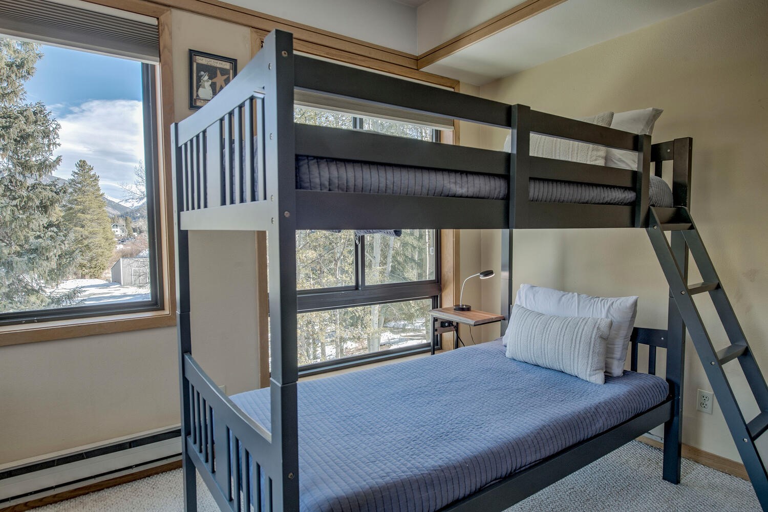 1211 West Keystone Road, Unit 2757 Keystone, CO 80435 - Photo 6 of 46 a bedroom with bunk bed and a window