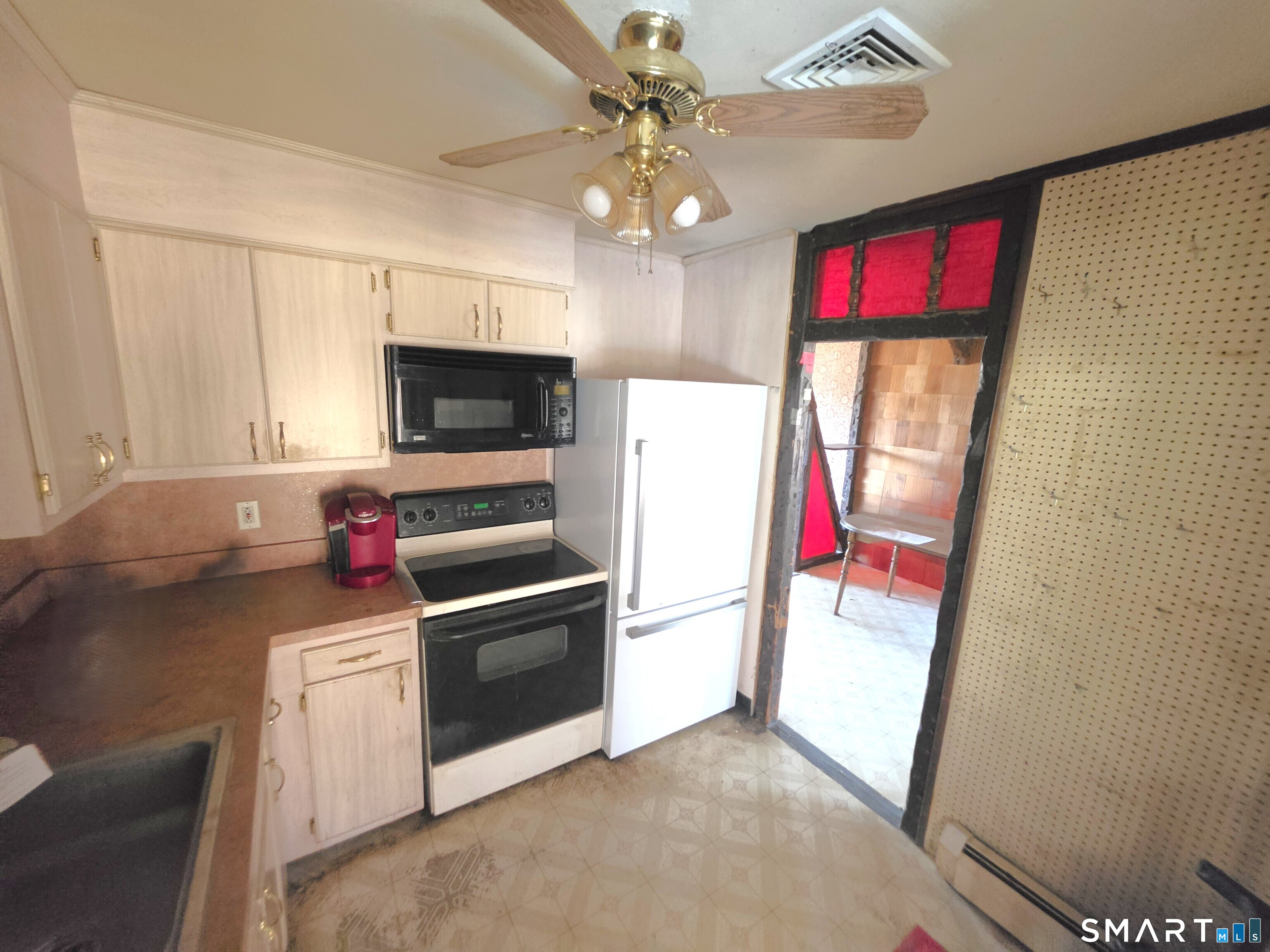 12 Brentwood Road New Milford, CT 06776 - Photo 11 of 21 a kitchen with a refrigerator and a stove