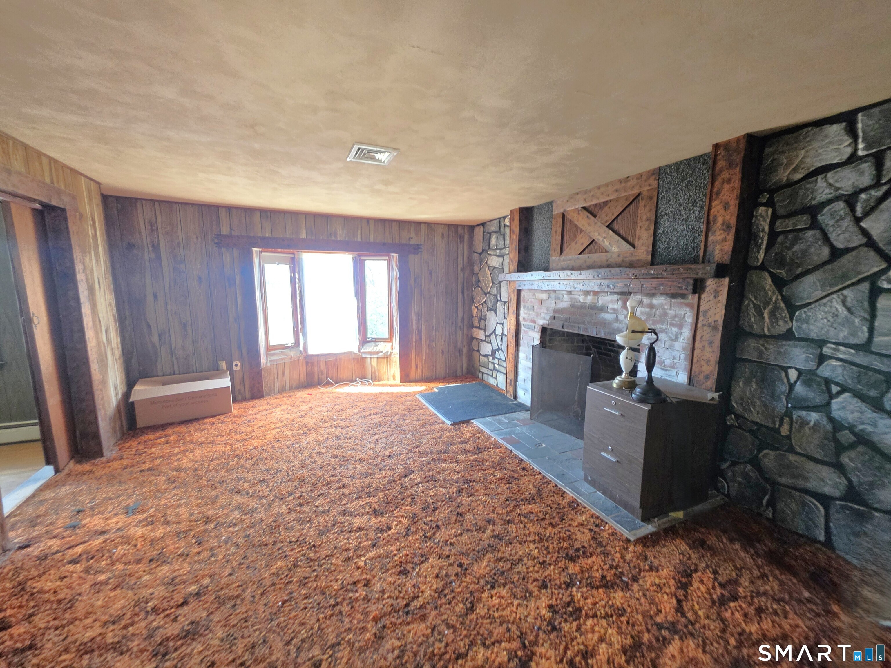 12 Brentwood Road New Milford, CT 06776 - Photo 12 of 21 a spacious bedroom with a bed and a fireplace