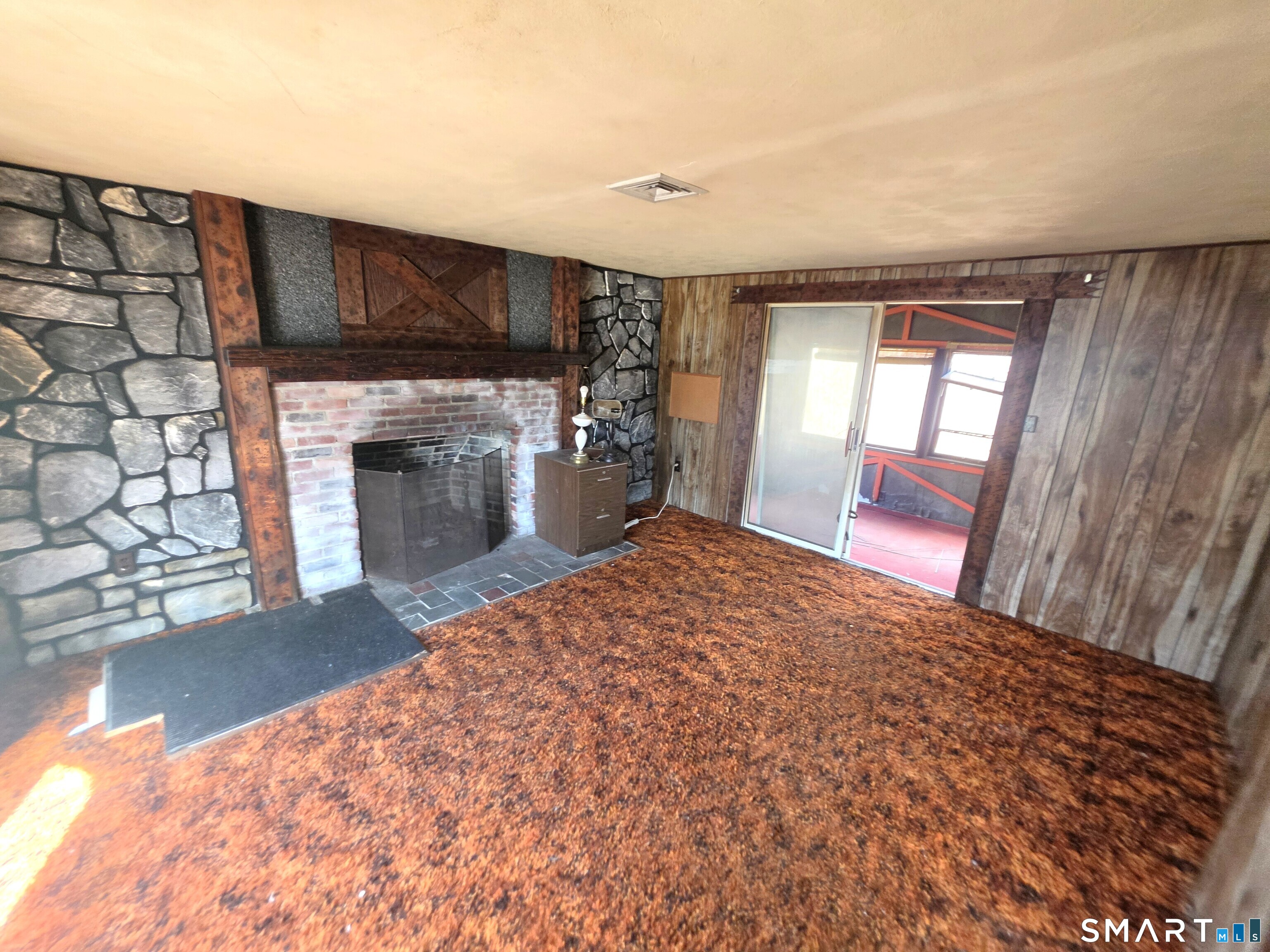 12 Brentwood Road New Milford, CT 06776 - Photo 13 of 21 a view of a livingroom with a fireplace