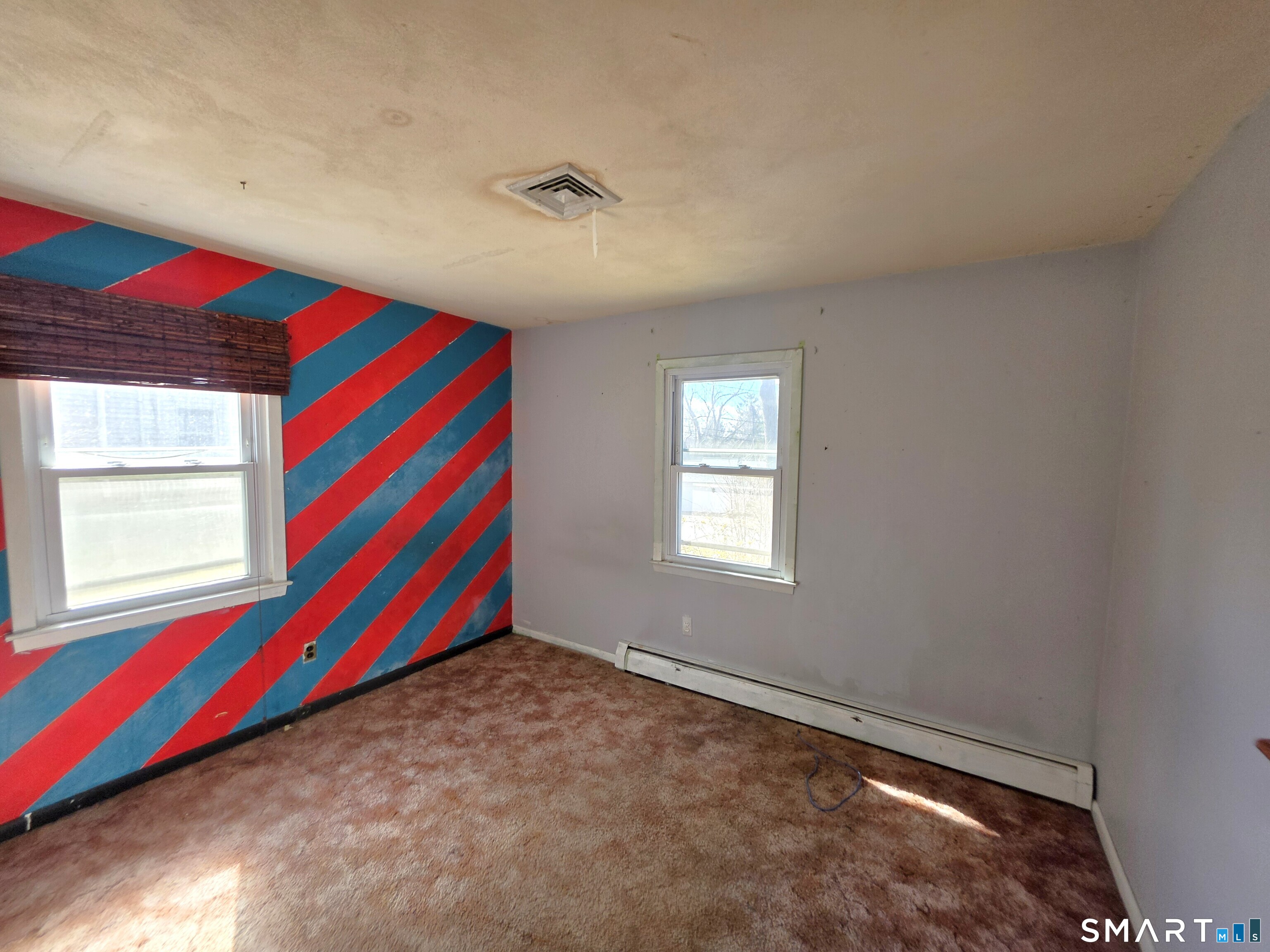 12 Brentwood Road New Milford, CT 06776 - Photo 17 of 21 a room with a bed and a window