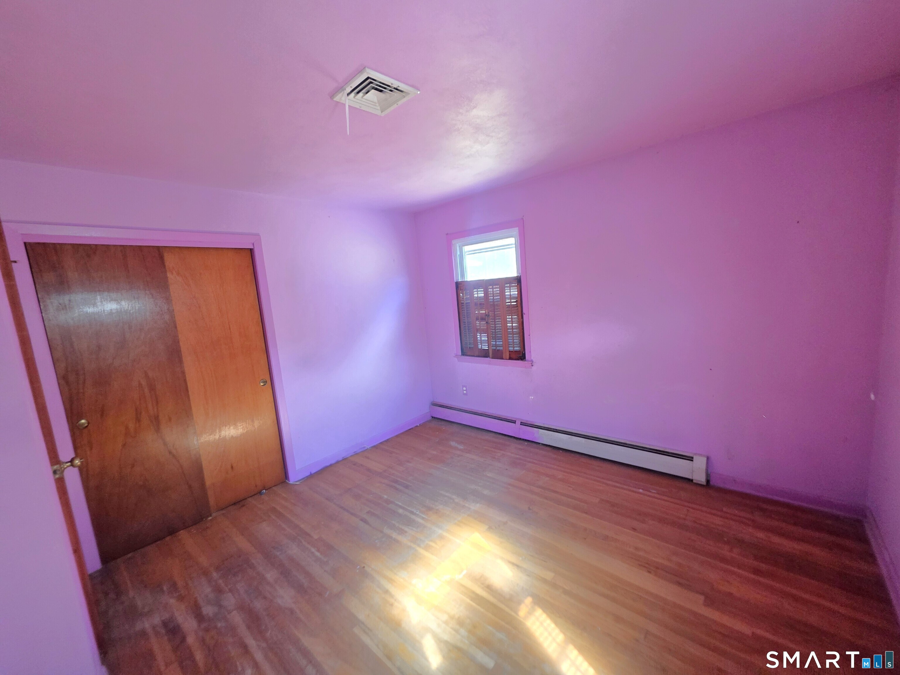 12 Brentwood Road New Milford, CT 06776 - Photo 20 of 21 a view of an empty room with wooden floor and a window