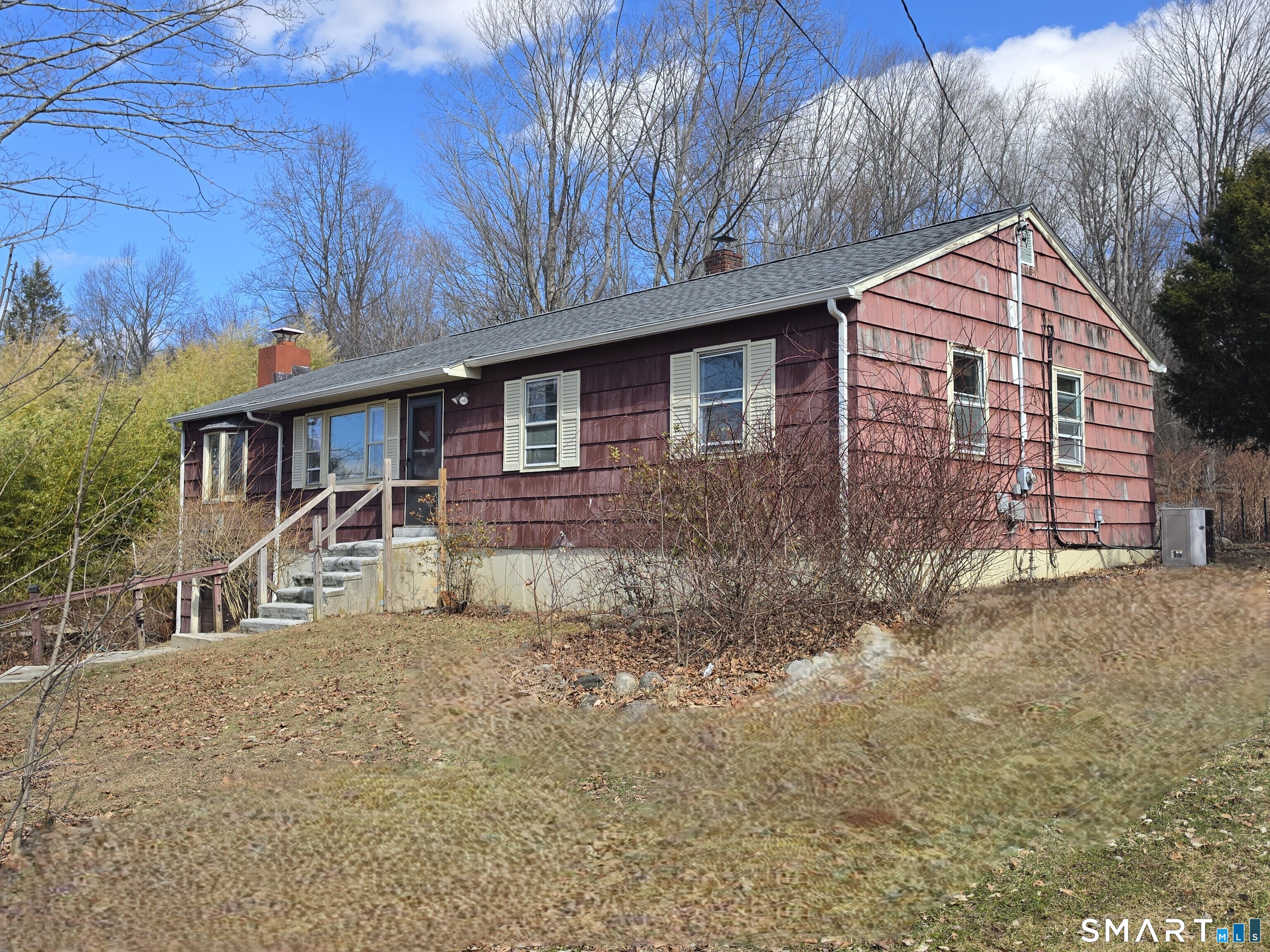 12 Brentwood Road New Milford, CT 06776 - Photo 3 of 21 a front view of a house with a yard