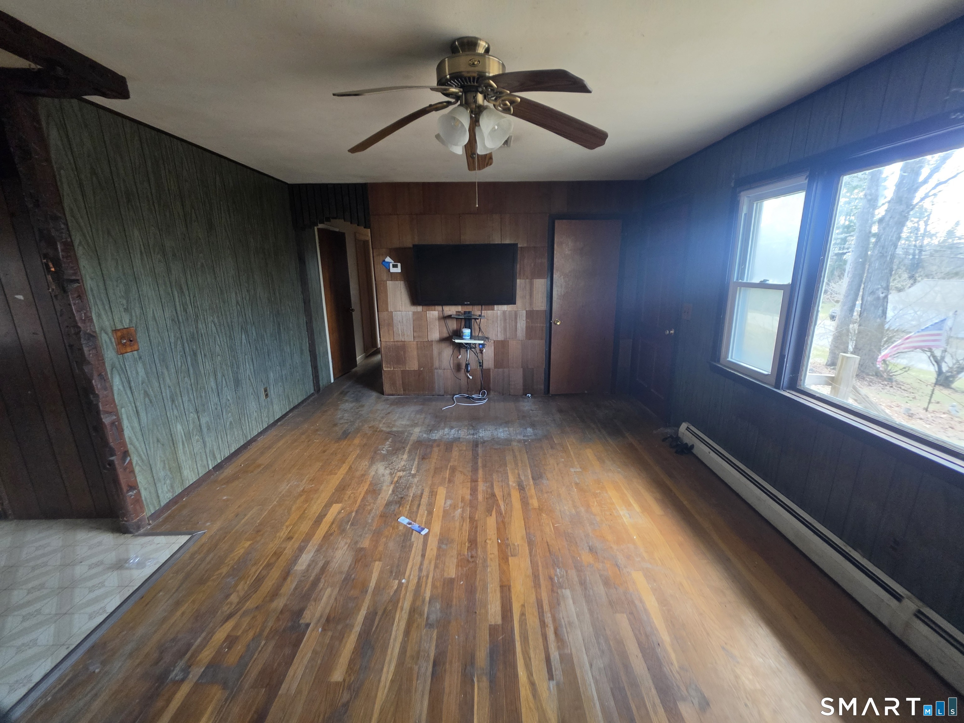 12 Brentwood Road New Milford, CT 06776 - Photo 7 of 21 a view of empty room with wooden floor and fan