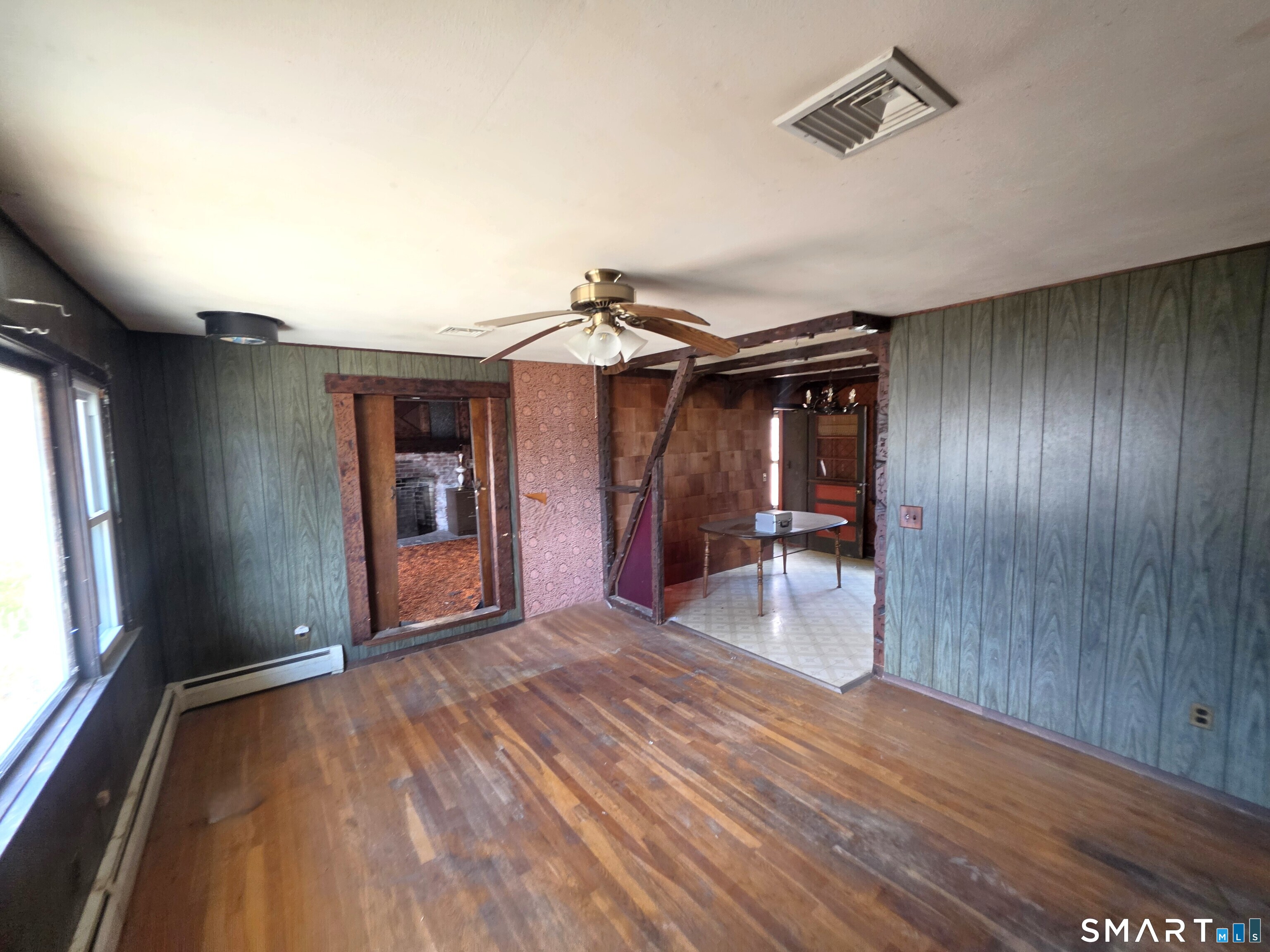 12 Brentwood Road New Milford, CT 06776 - Photo 9 of 21 a view of empty room with wooden floor and fan