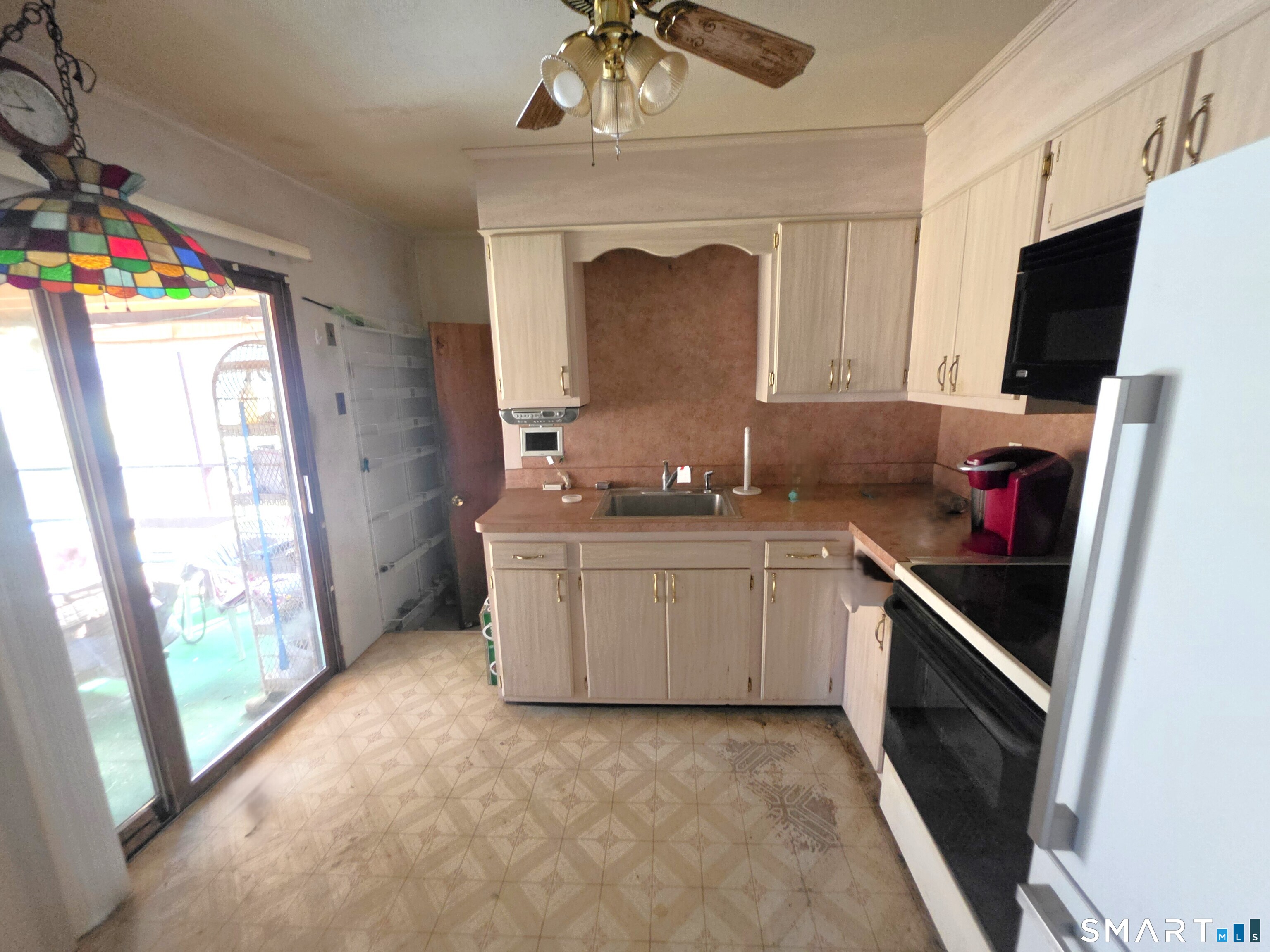 12 Brentwood Road New Milford, CT 06776 - Photo 10 of 21 a kitchen with a sink stove and refrigerator