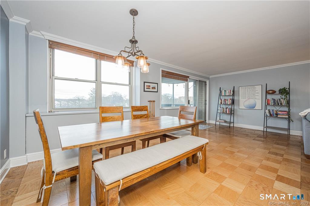 50 Glenbrook Road, Unit 6E Stamford, CT 06902 - Photo 8 of 18 a living room with furniture a table and large window