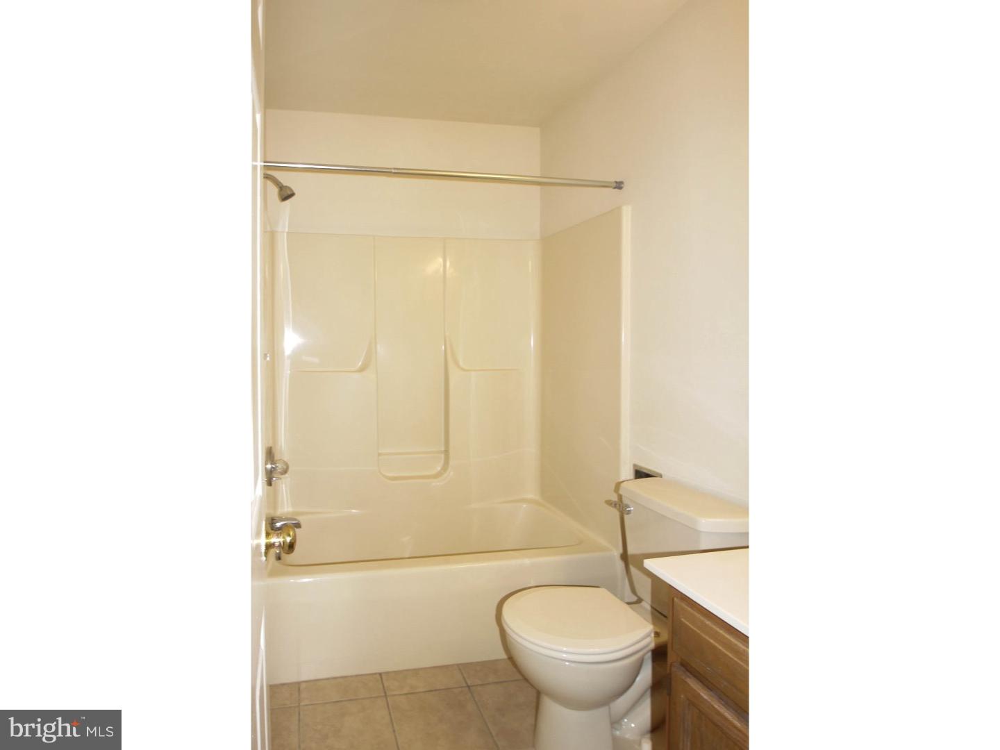 1468 Pershing Boulevard Reading, PA 19607 - Photo 15 of 15 a bathroom with a sink a toilet and shower
