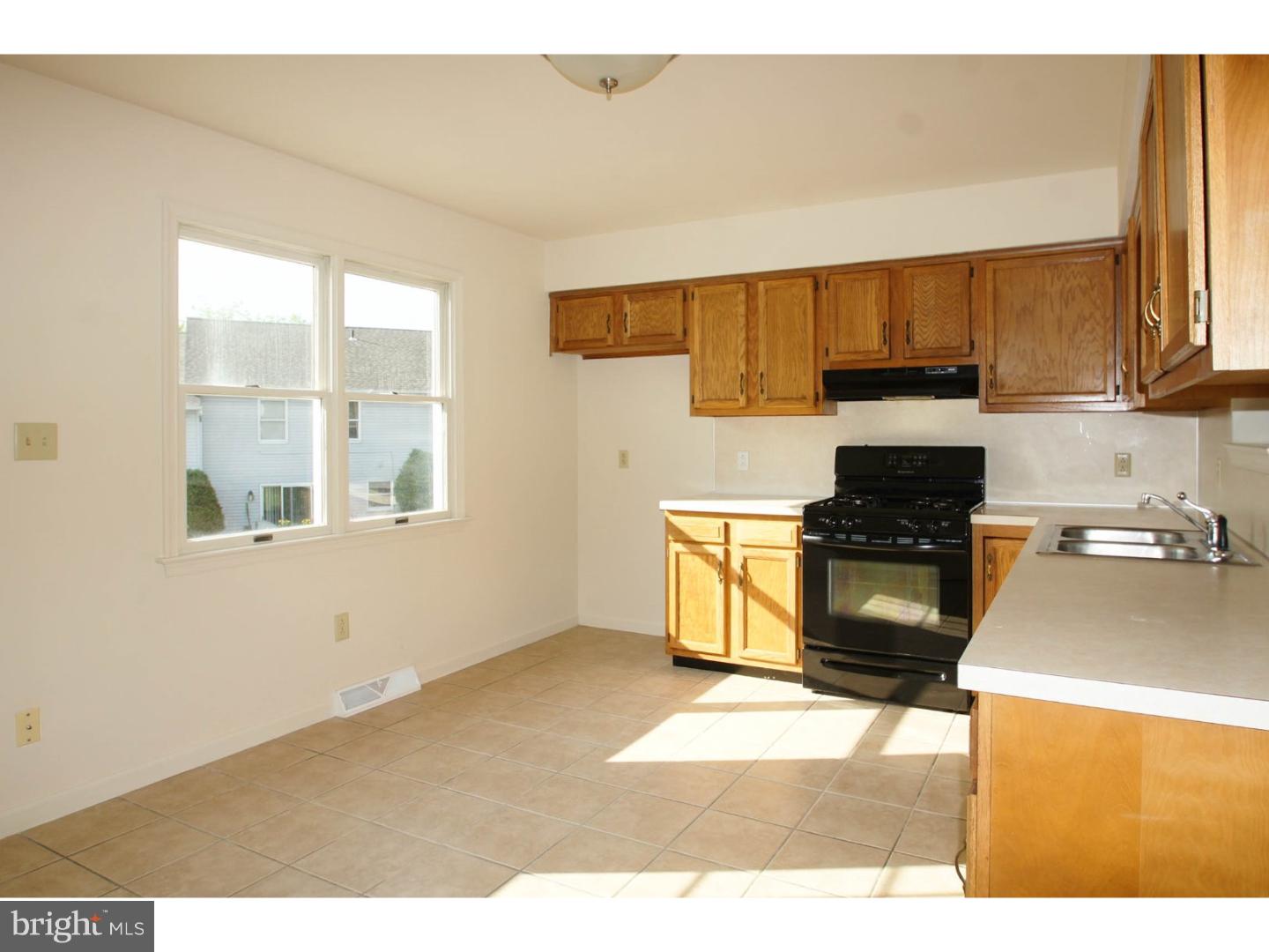 1468 Pershing Boulevard Reading, PA 19607 - Photo 5 of 15 a kitchen with a cabinets and appliances