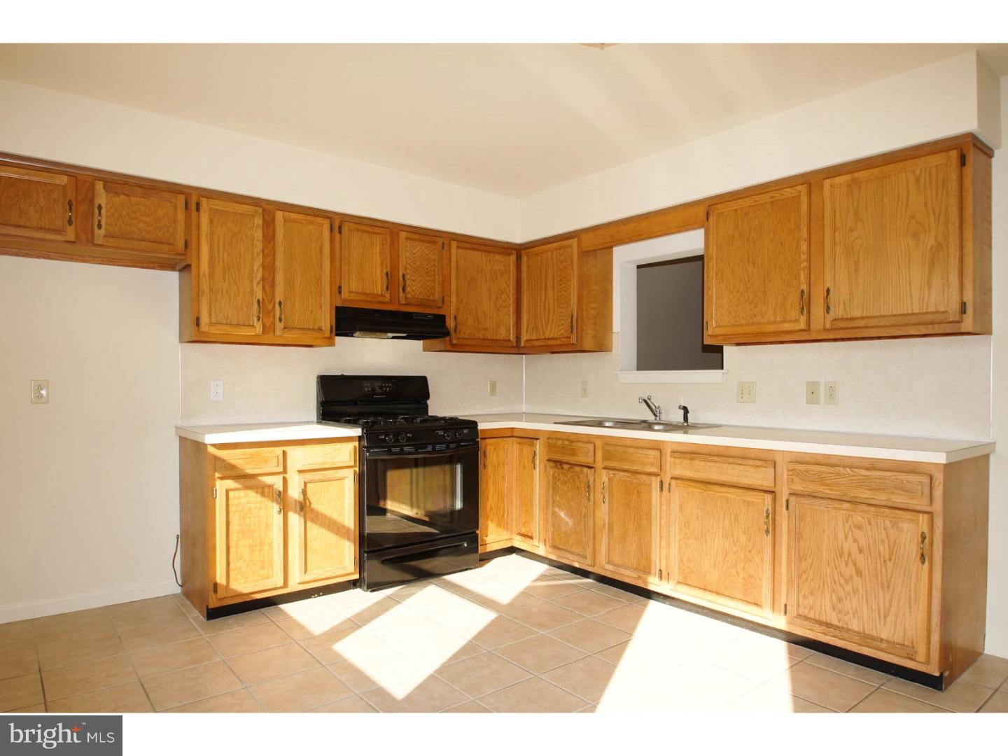 1468 Pershing Boulevard Reading, PA 19607 - Photo 6 of 15 a kitchen with stainless steel appliances granite countertop a stove a sink and a microwave