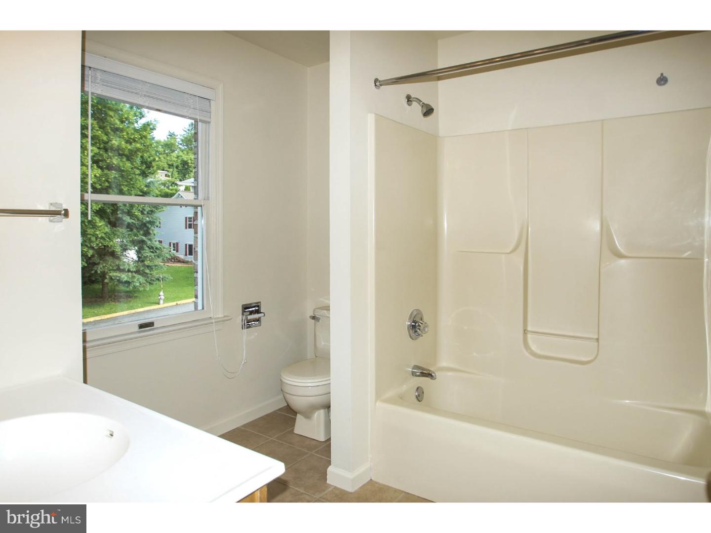 1468 Pershing Boulevard Reading, PA 19607 - Photo 10 of 15 a bathroom with a bathtub and a shower