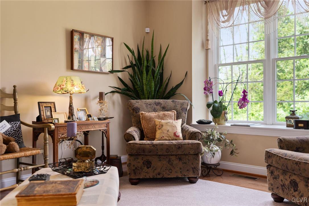 6081 Upper Ridge Road Green Lane, PA 18054 - Photo 13 of 39 a living room with furniture a chandelier and a window