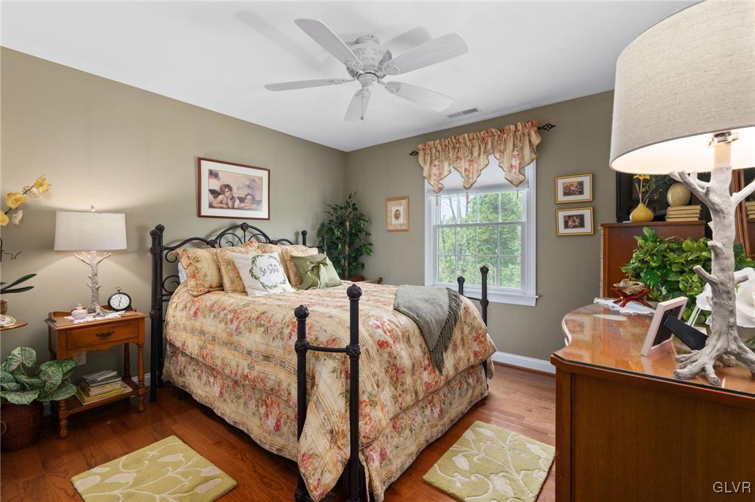 6081 Upper Ridge Road Green Lane, PA 18054 - Photo 29 of 39 a bedroom with a bed and a large window with outer view