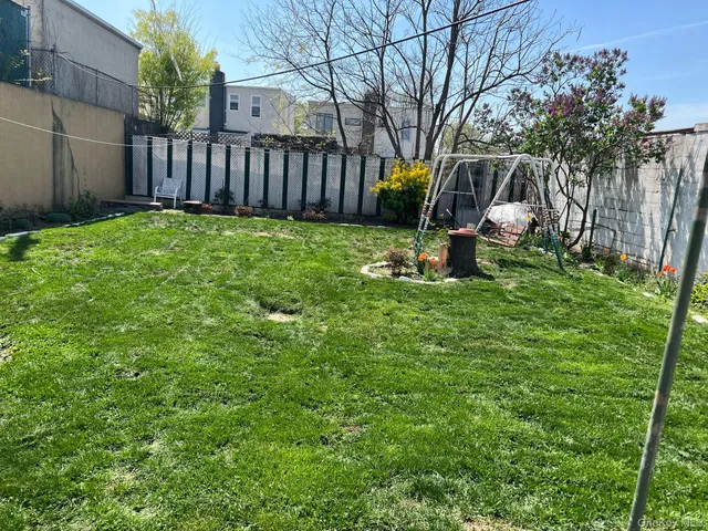 a view of a backyard with a small cabin