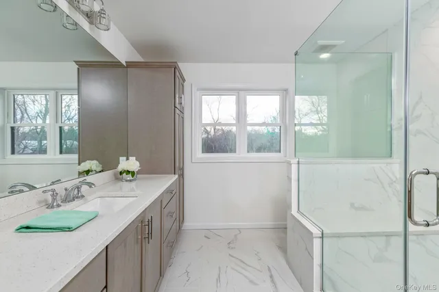 a bathroom with a sink and a mirror