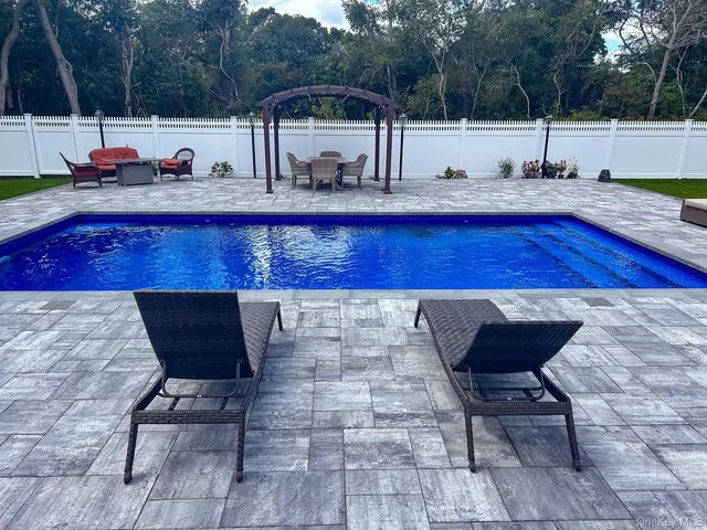 a view of a chairs and table on the terrace