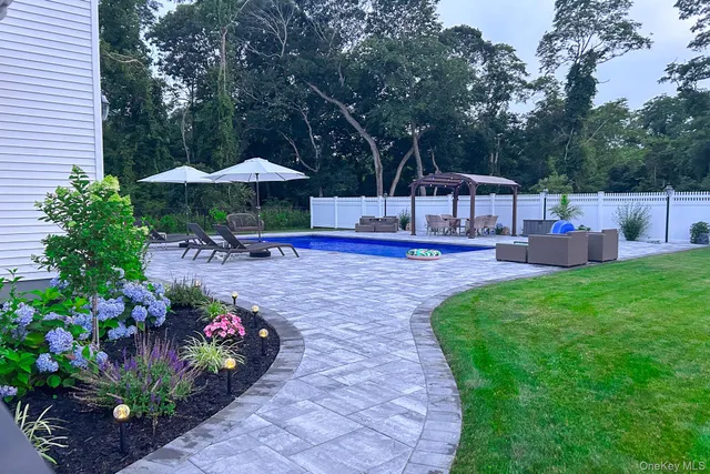 a view of a garden with patio