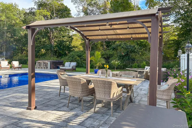 a view of a patio with a table chairs and a table