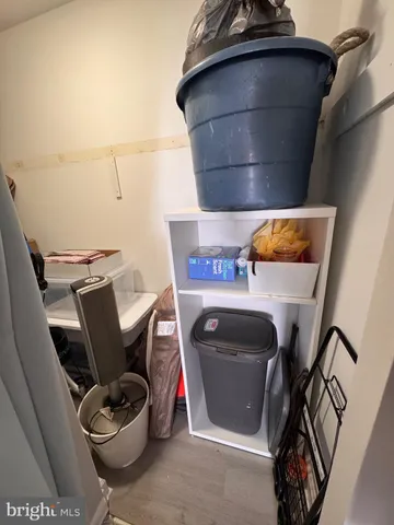 a bedroom with a bed and a flat tv screen on wall