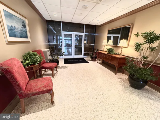 a view of a pool with two windows