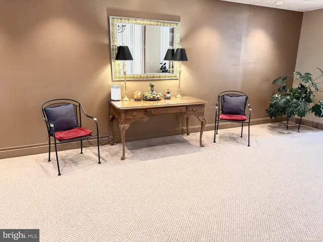 an empty room with wooden floor and a window